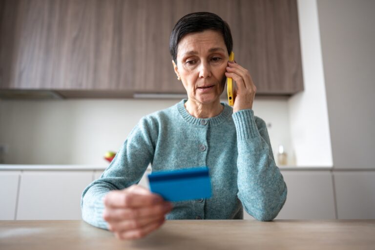 Scared confused naive woman transferring money accounts scammers phone fraud financial manipulation